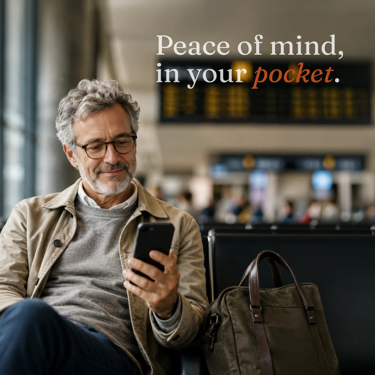 travelTraveler sitting in an airport lounge with a smartphone and bag, showing peace of mind from tracking important belongings with Trace Vault.