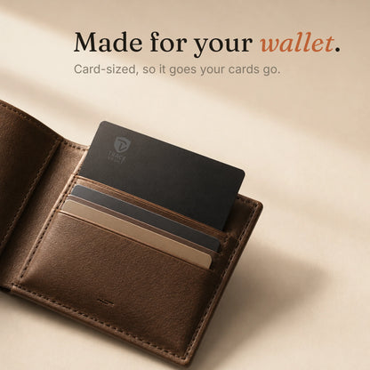 Open leather cardholder wallet containing a Trace Vault tracking card among regular cards, showing its credit card-sized wallet fit.